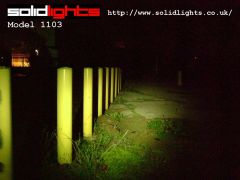 1103 shining along row of yellow poles at 4 foot intervals